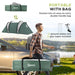 Man carries Outsunny green tunnel tent bag at campsite, with tent and accessories shown.