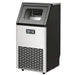 Ice machine with black top and silver front on a white background