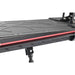 Close-up of 48V folding electric scooter deck with textured black surface and red accent.