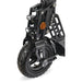 Close-up of folding electric scooter front wheel with dual suspension and LED lights