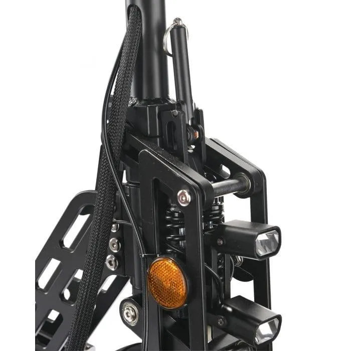 Close-up of folding electric scooter front suspension, dual headlights, and orange reflector