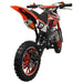 Red kids mini dirt bike with knobby tires and number 21, viewed from the rear