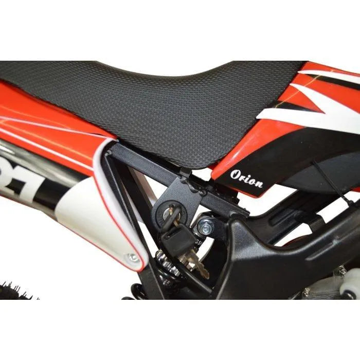 Close-up of red kids mini dirt bike seat and frame with Orion branding