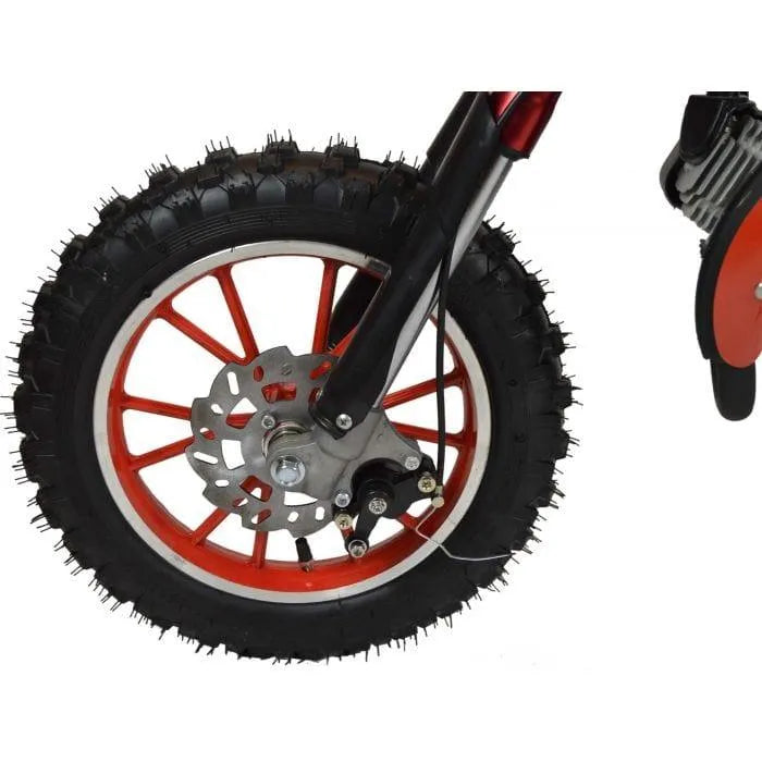 Close-up of a red mini dirt bike front wheel with knobby tire and disc brake