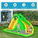 Kids playing on green and yellow inflatable garden water slide with ball pit and climbing wall