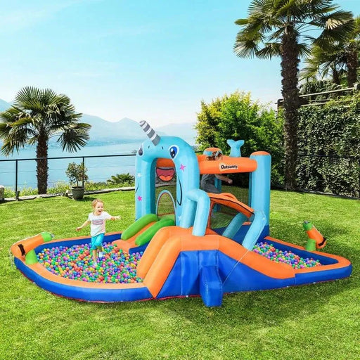 Child playing on Outsunny 5-in-1 inflatable bouncy castle water park with slides and pool