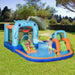 Kids play on an outdoor 5-in-1 bouncy castle water park with slides, pool, and water gun