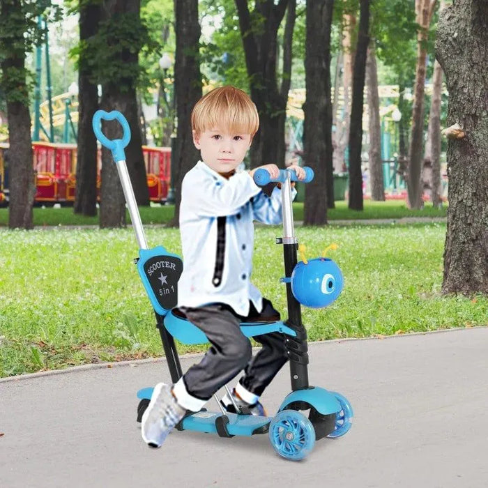 Boy riding blue 5-in-1 kids kick scooter with seat and parent handle in park