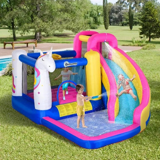 Kids playing on Outsunny 5-in-1 unicorn bouncy castle water park with slide and pool outdoors