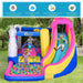 Kids playing on a colorful 5-in-1 unicorn inflatable bouncy castle with slide and ball pit outdoors