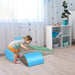 Toddler playing on 5-piece soft foam activity play set in colorful nursery room