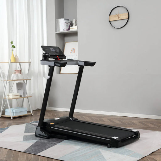 Black treadmill in a room with a rug and shelves.