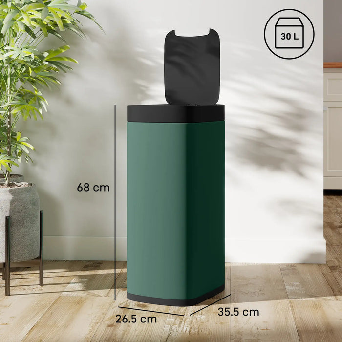 Green touchless sensor trash bin with black lid, 30L capacity, dimensions marked, placed on wooden floor near plant