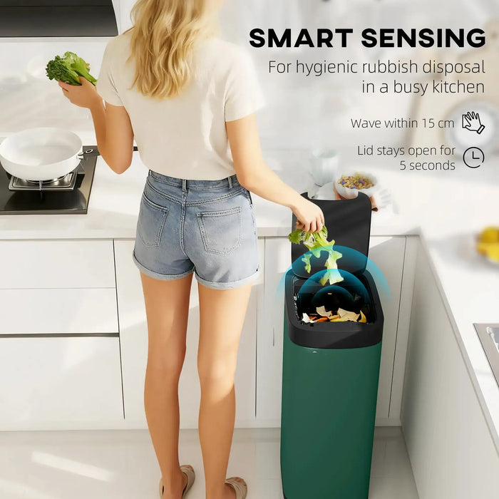 Woman disposing food waste in a green touchless sensor rubbish bin in a modern kitchen