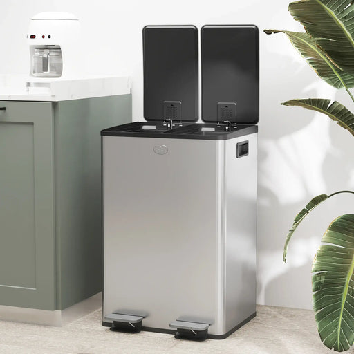 Stainless steel trash bin with black lids in a kitchen setting