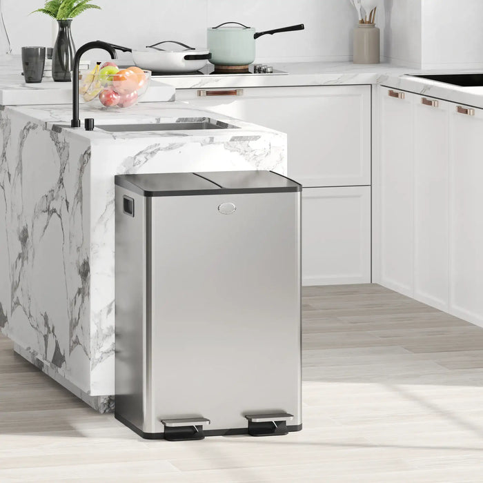 Stainless steel trash can in a modern kitchen with marble island