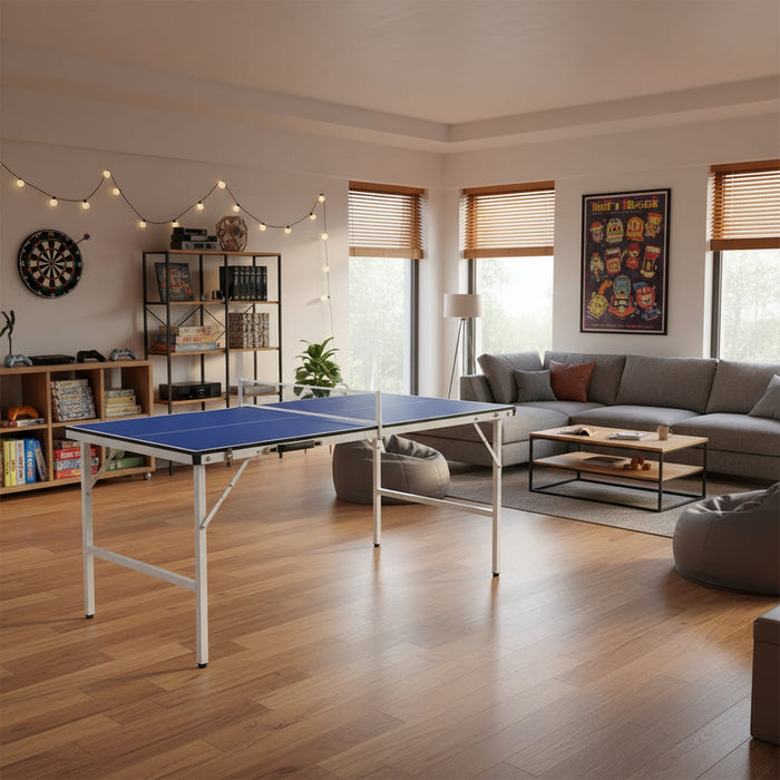 Blue compact ping pong table in modern games room with couch, bookshelf, and dartboard