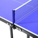 Close-up of blue 5ft professional table tennis table with net and dual carry handles