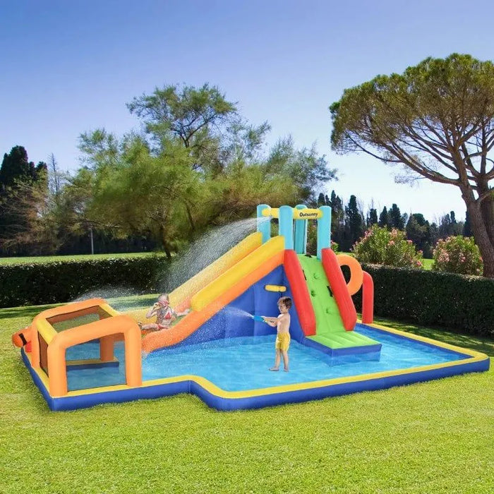 Kids playing on Outsunny 6-in-1 giant inflatable water park with slide, pool, and climbing wall outdoors