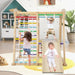 Kids playing on indoor wooden jungle gym with slide, monkey bars, and rope ladder