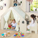 Montessori indoor playhouse activity center with two kids and educational toys in a bright room