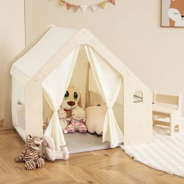 Montessori indoor playhouse with plush toys, child table and chairs in cozy playroom