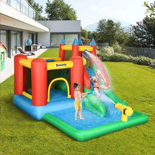 Kids playing on Outsunny inflatable bouncy castle water slide with pool and water gun in backyard