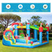 Kids playing on colorful Outsunny inflatable bouncy house with water slide and pool outdoors