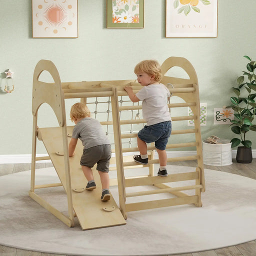 Two children playing on a wooden climbing toy in a room with light green walls and decorative elements.