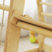 Close-up of a wooden chair with blurred background