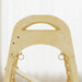 Wooden climbing toy with a handle on a white background