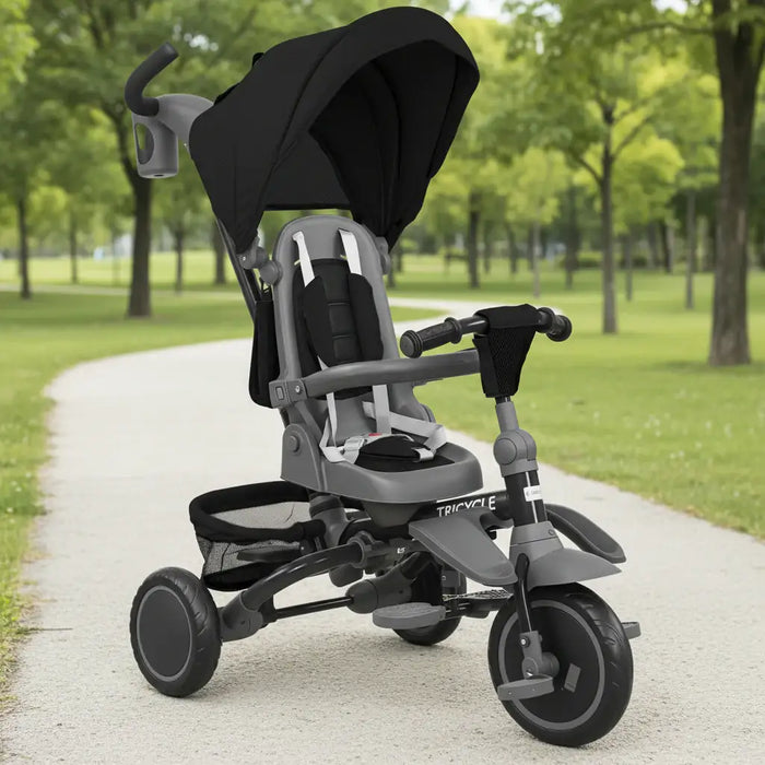 Child's tricycle with canopy in a park setting