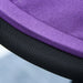 Close-up of a purple cushion with a black mesh backrest on a light blue background