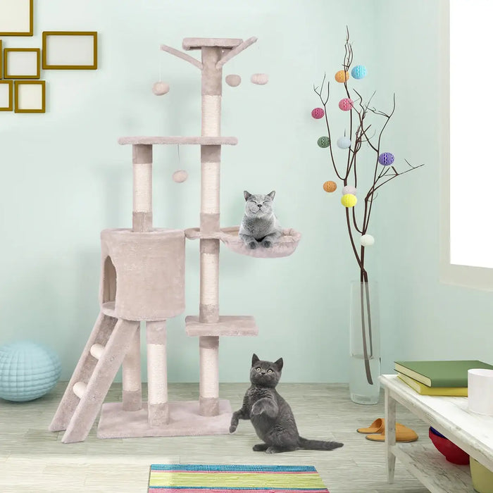 Cat tree with multiple levels and a cat sitting on one of the platforms in a room.