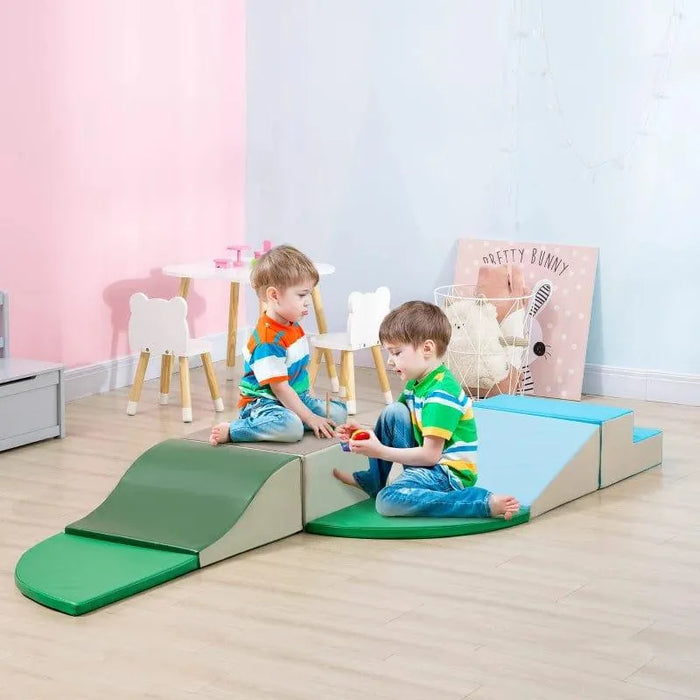 Two boys playing on a colorful foam soft playset in a bright kids' playroom