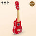 Red 6-string kids acoustic guitar, 53cm wooden toy for beginners, on beige background