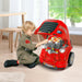 Child playing with red kids engine toy set, vehicle maintenance workshop indoors