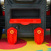 Close-up of kids' red and gray toy vehicle maintenance workshop set on colorful mat