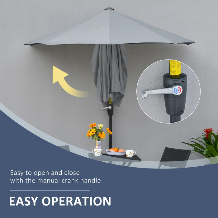 Outdoor umbrella with manual crank handle on a gray background
