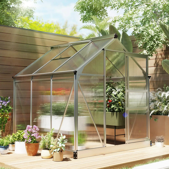 Small greenhouse with plants on a wooden deck