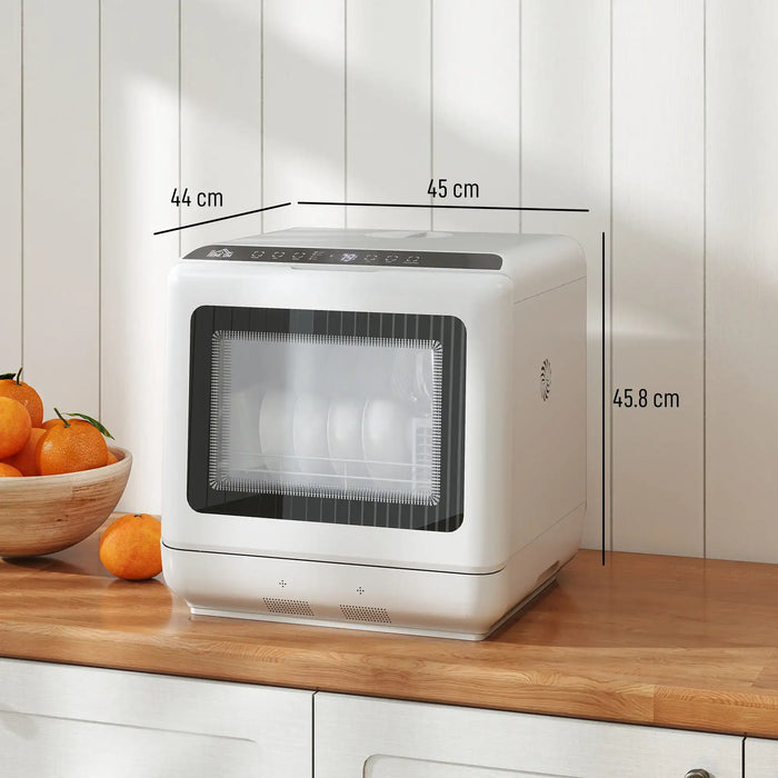 White dishwasher on a kitchen counter with dimensions labeled, surrounded by oranges and a bowl.