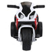 Front view of red and white kids electric ride-on motorcycle with black handlebars and wide tires
