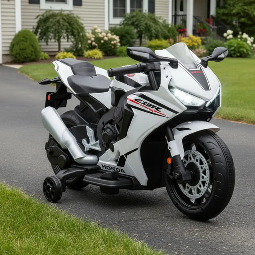 White Honda motorcycle with black accents in a front garden setting