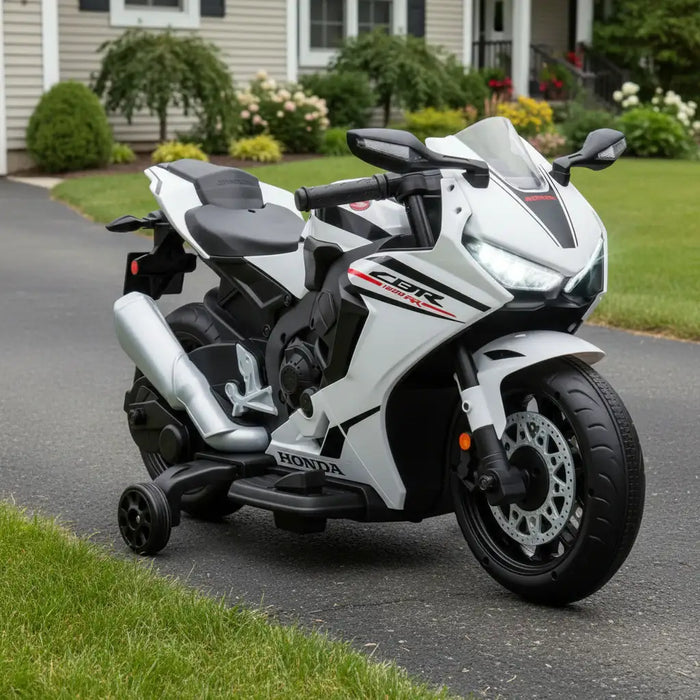 White Honda motorcycle with black accents in a front garden setting