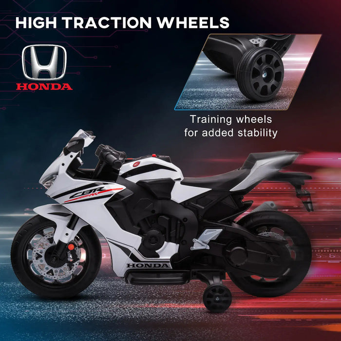 Honda toy motorcycle with high traction wheels on a dark background