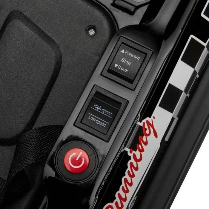 Close-up of HOMCOM kids bumper car controls with power button and speed settings.
