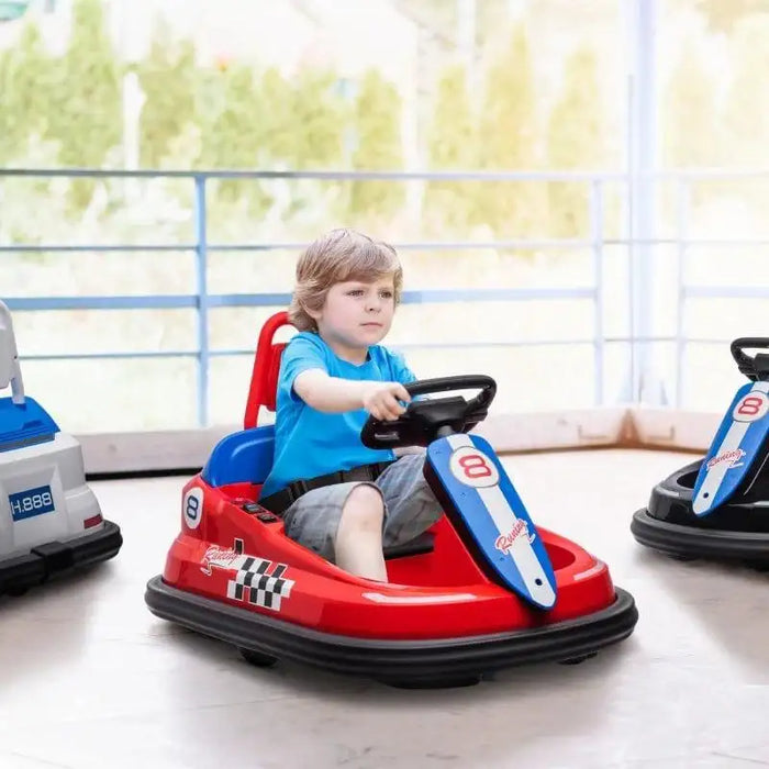 Boy riding red 6V kids bumper car indoors with 360 spin design and racing decals
