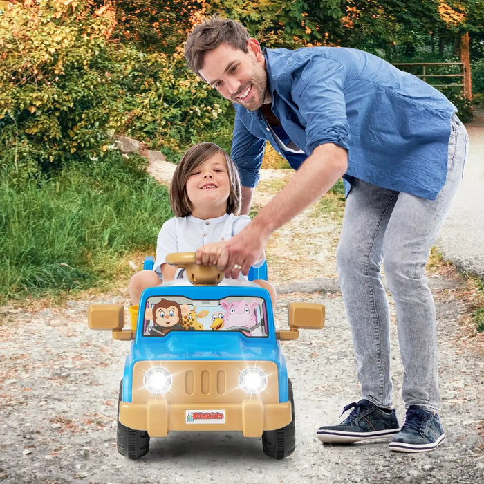 Father pushing smiling child in blue battery-powered ride-on toy car on outdoor path
