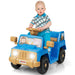 Toddler boy riding blue and tan battery-powered toy jeep with animal decals and working headlights
