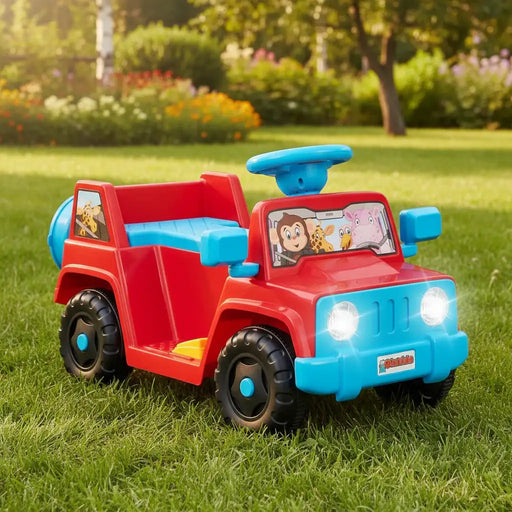 Red and blue kids ride-on toy car with playful animal decals on grassy lawn